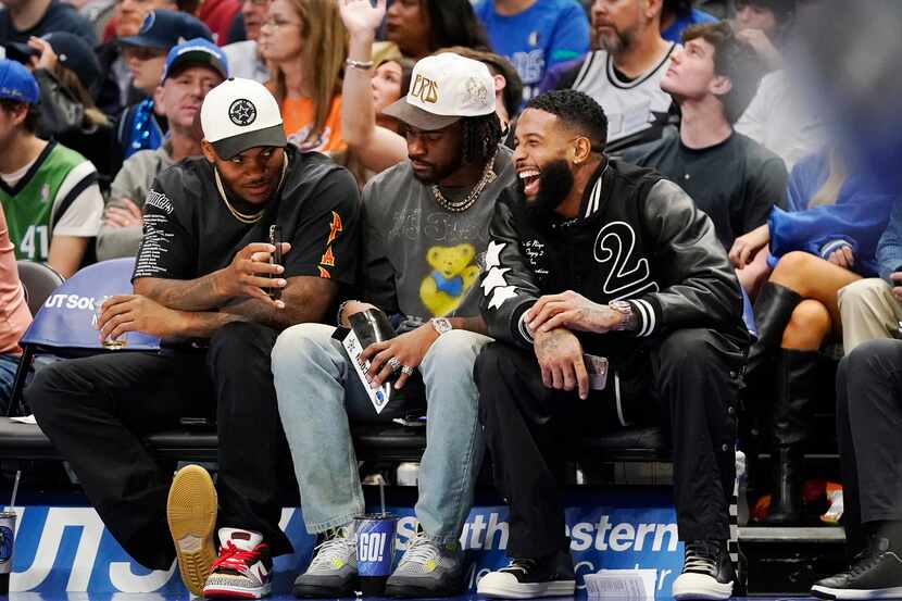Free agent Odell Beckham Jr. (right) laughs with Dallas Cowboys players Micah Parsons (left)...
