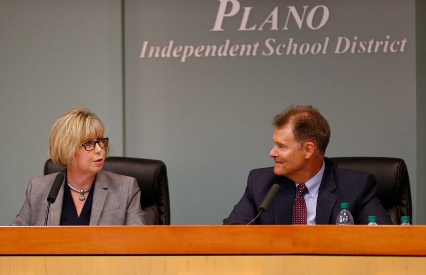 Plano ISD Superintendent Brian Binggeli receives compliments from board president Missy...