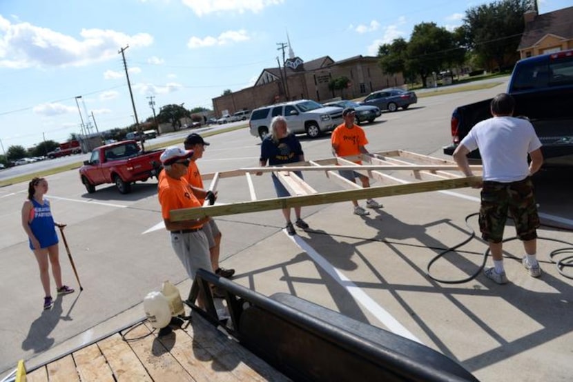 
Members of First United Methodist Church Duncanville transport framework to the shipping...