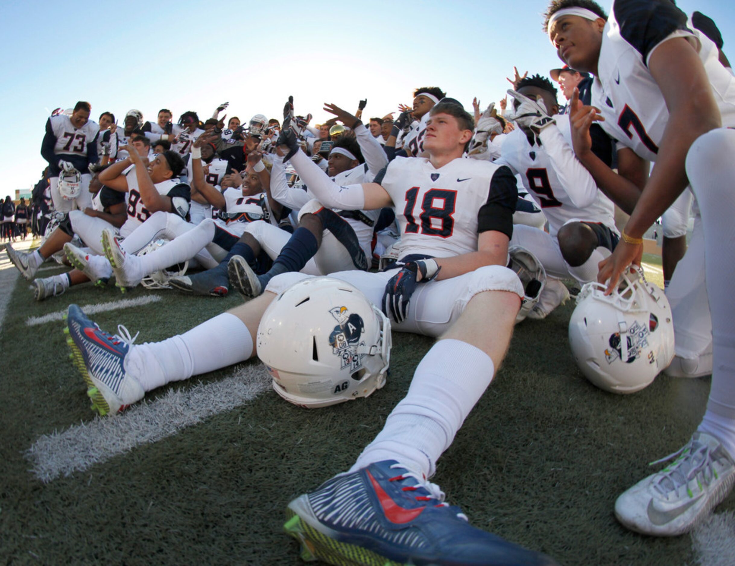 Members of the Allen Eagles mug for photographers as they pose with their Class 6A state...