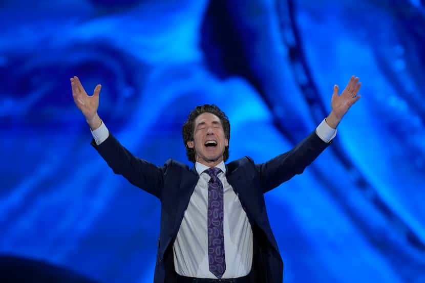 Pastor Joel Osteen prays during a service at Lakewood Church in Houston, on  Sunday, Feb....
