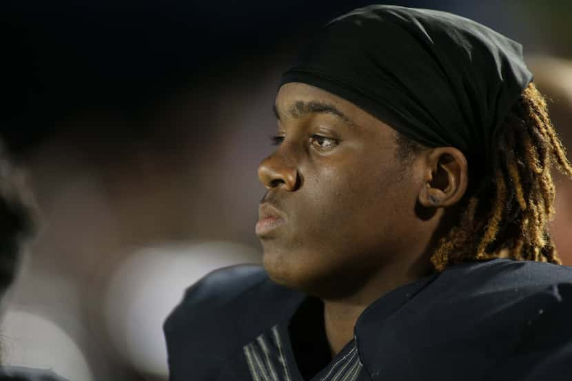 Irving High’s James Miles, cq, 35, prior to game action and MacArthur, Friday 10â“02-2015,...