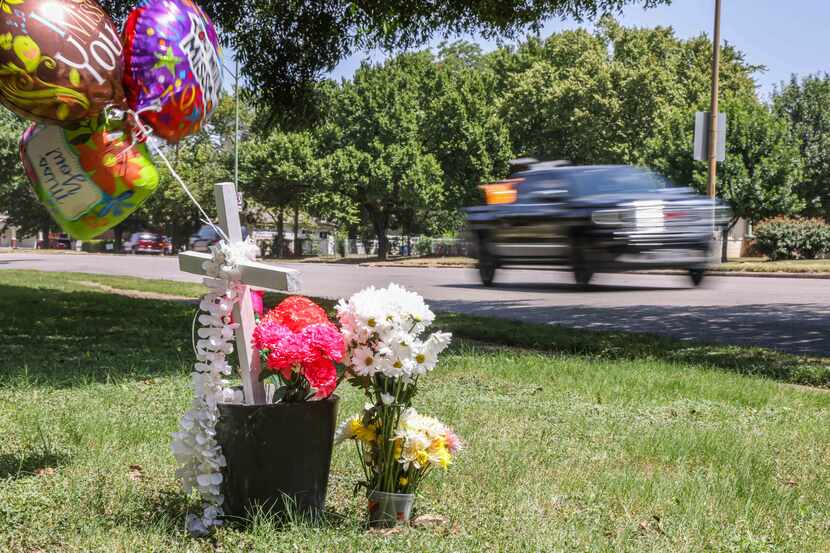 A memorial honors Armando Leija Esparza near the intersection of West Jefferson Boulevard...