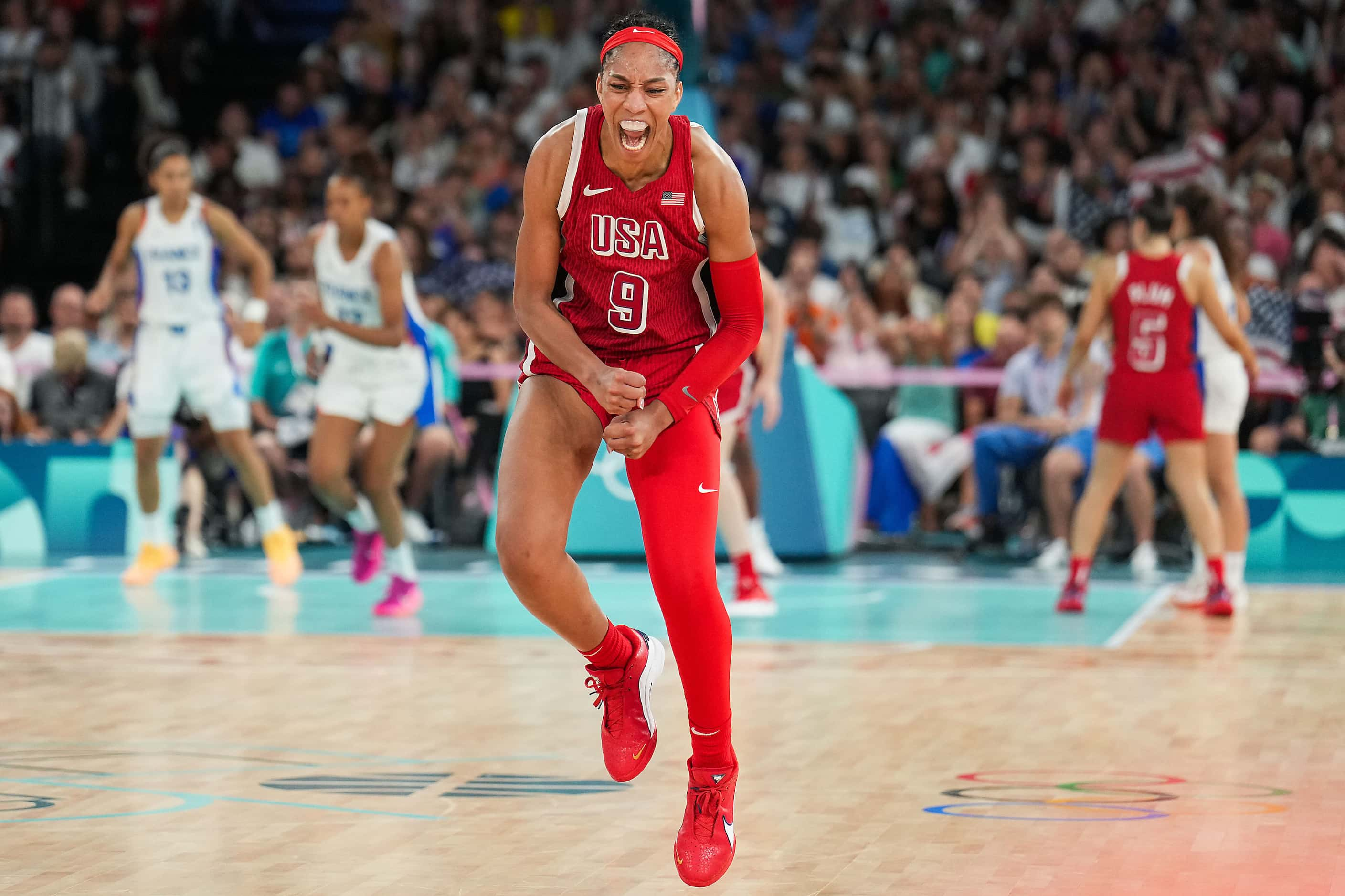 A'Ja Wilson (9) of the United States celebrates a basket during the second half of the...