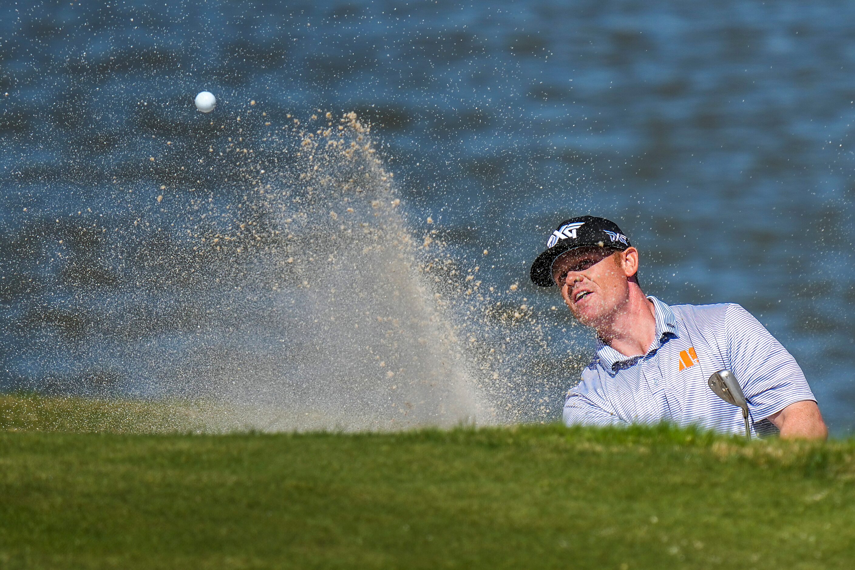 Patrick Fishburn hits from a bunker on the 13th hole during the final round of the Korn...