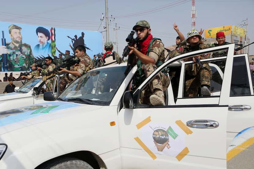 Volunteers of the newly formed "Peace Brigades" participate in a parade in Basra, Iraq's...