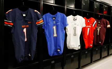 Some of the Frisco ISD jerseys on display in the high school locker room at The Star, the...