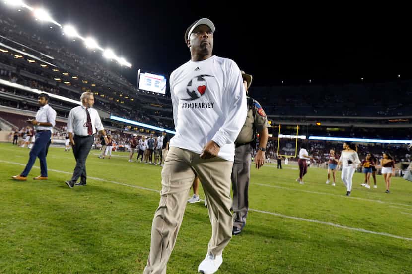 Texas A&M Aggies head coach Kevin Sumlin walks off the field after escaping with a win over...