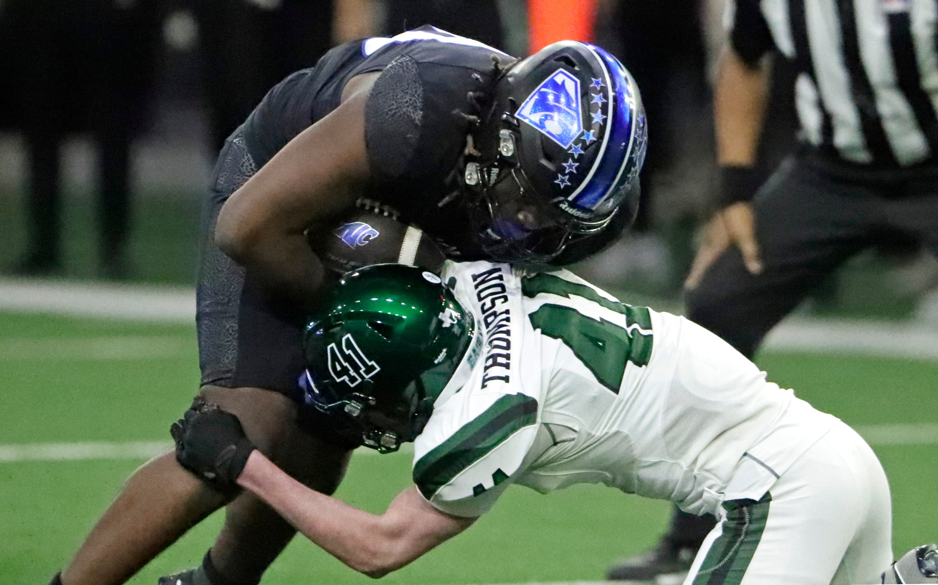 North Crowley High School tight end Jayden Shaw (20) is met by Prosper High School...