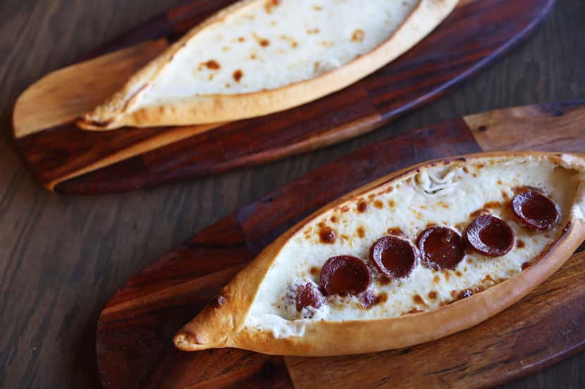 Lezzet Cafe offers several versions of pide, or Turkish pizza, including kasarli, which is...