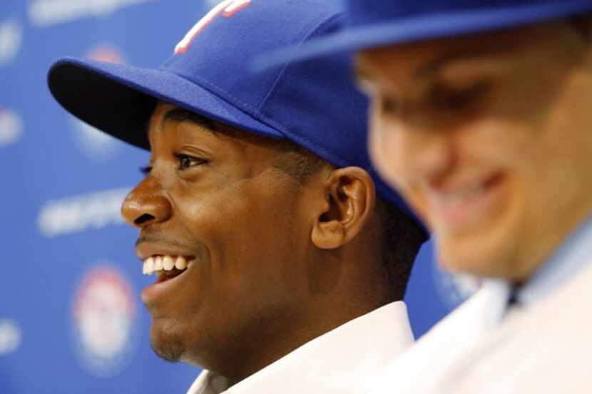 Texas Rangers draft pick Alex Speas (left) and Kole Enright smile during a press conference...