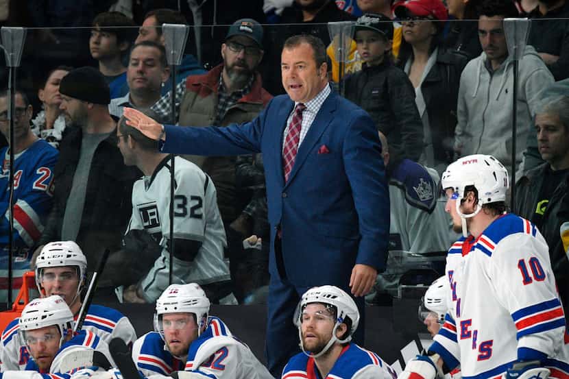 FILE - In this Jan. 21, 2018 file photo, New York Rangers coach Alain Vigneault gestures...