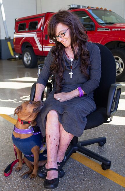 Danyeil Townzen pets her service dog, Cowboy. The pair was reunited after nearly 17 months...