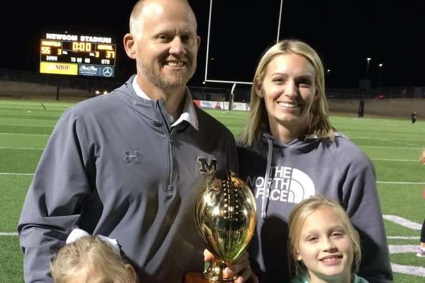 Mansfield football coach Daniel Maberry with his wife, Cami, and their two daughters. 