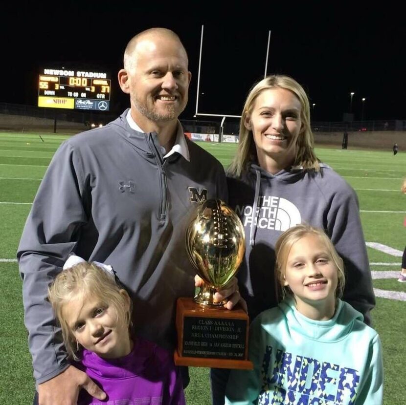 Mansfield football coach Daniel Maberry with his wife, Cami, and their two daughters. 