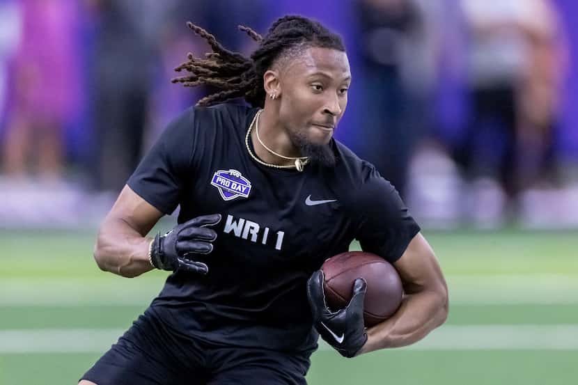 TCU football wide receiver Quentin Johnston carries a pass during NFL Pro Day, Thursday,...