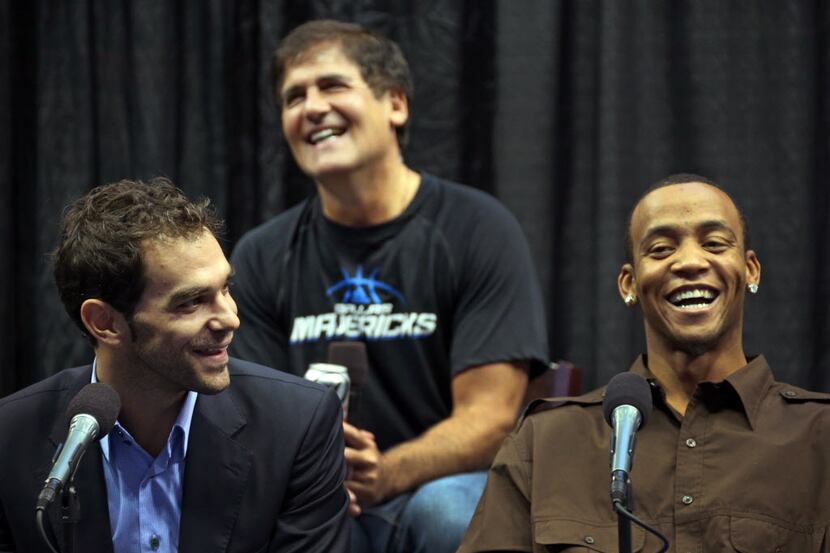 New Dallas Mavericks players Jose Calderon, Monta Ellis and owner Mark Cuban share a laugh...