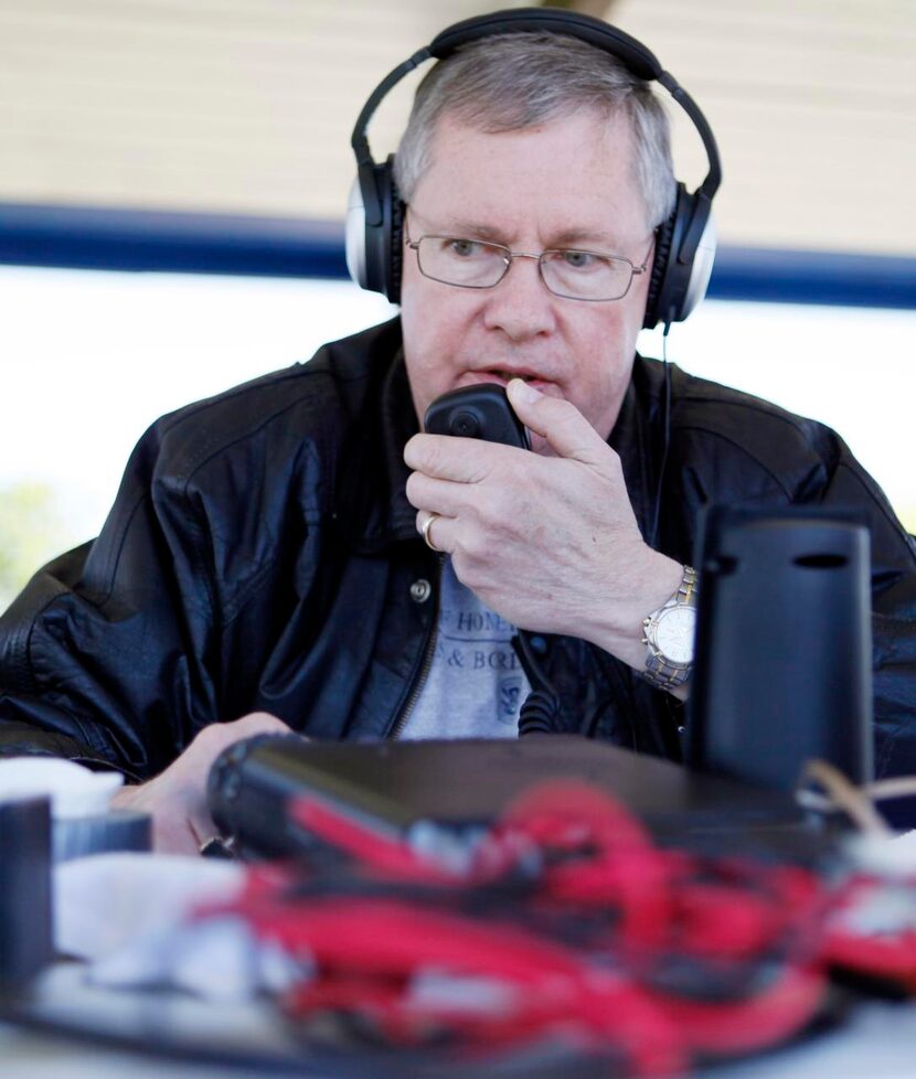 
David Lewis, 62, of Lewisville, attempts to make contact with a radio user at the Texas...