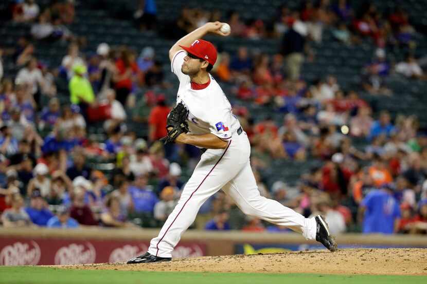 Texas Rangers relief pitcher Ricky Rodriguez (68) throws to the Detroit Tigers in the...