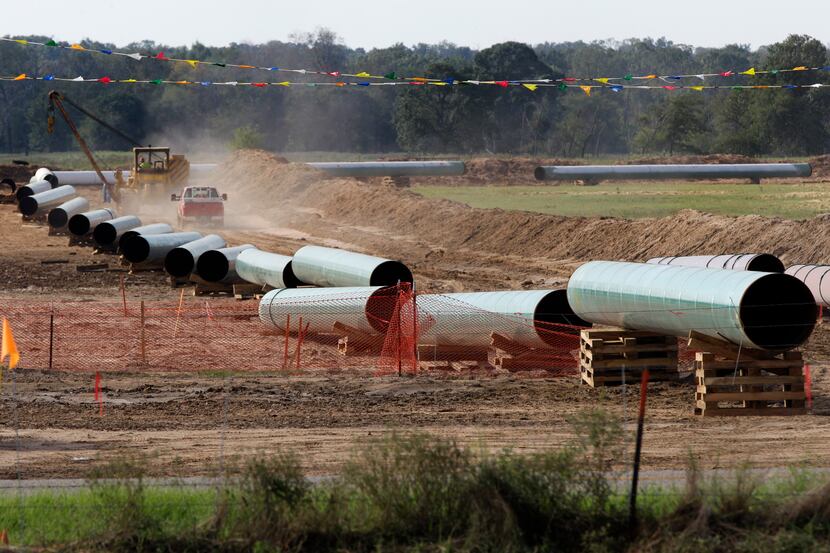 File - In the is Oct. 4, 2012 file photo, large sections of pipe are shown on a neighboring...