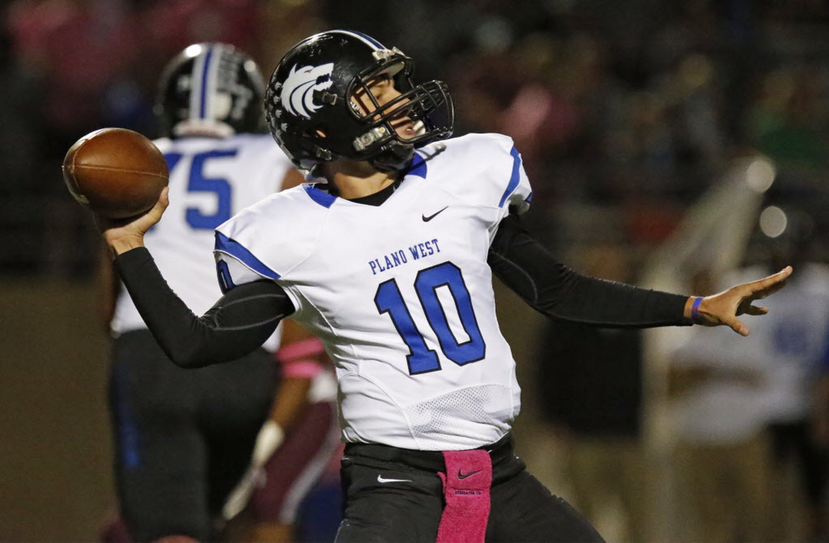 Plano West High School quarterback Logan Williams (10) throws a pass in the first quarter ...