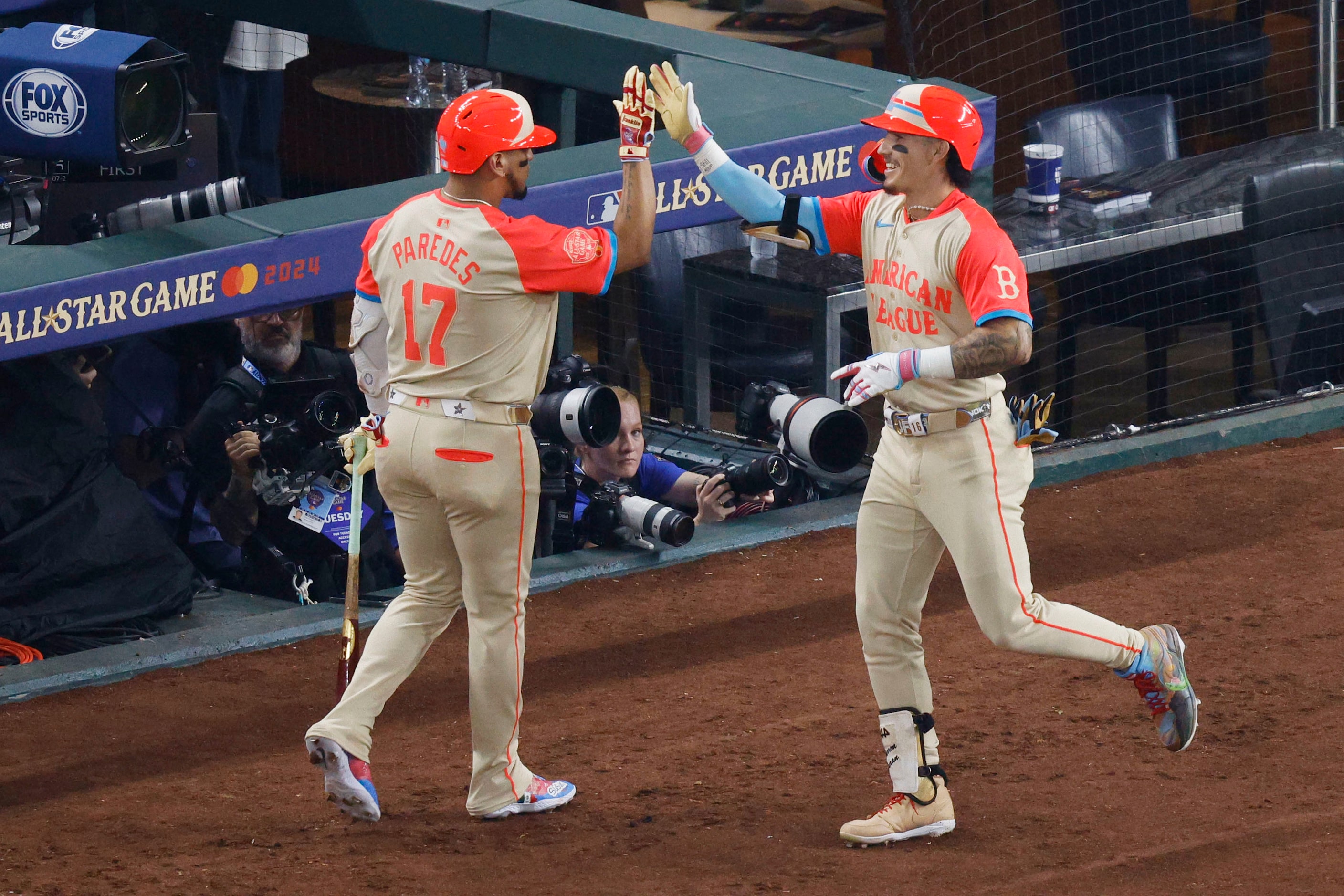 American League's Jarren Duran of Boston Red Sox (16), right, gets a high-five from his...