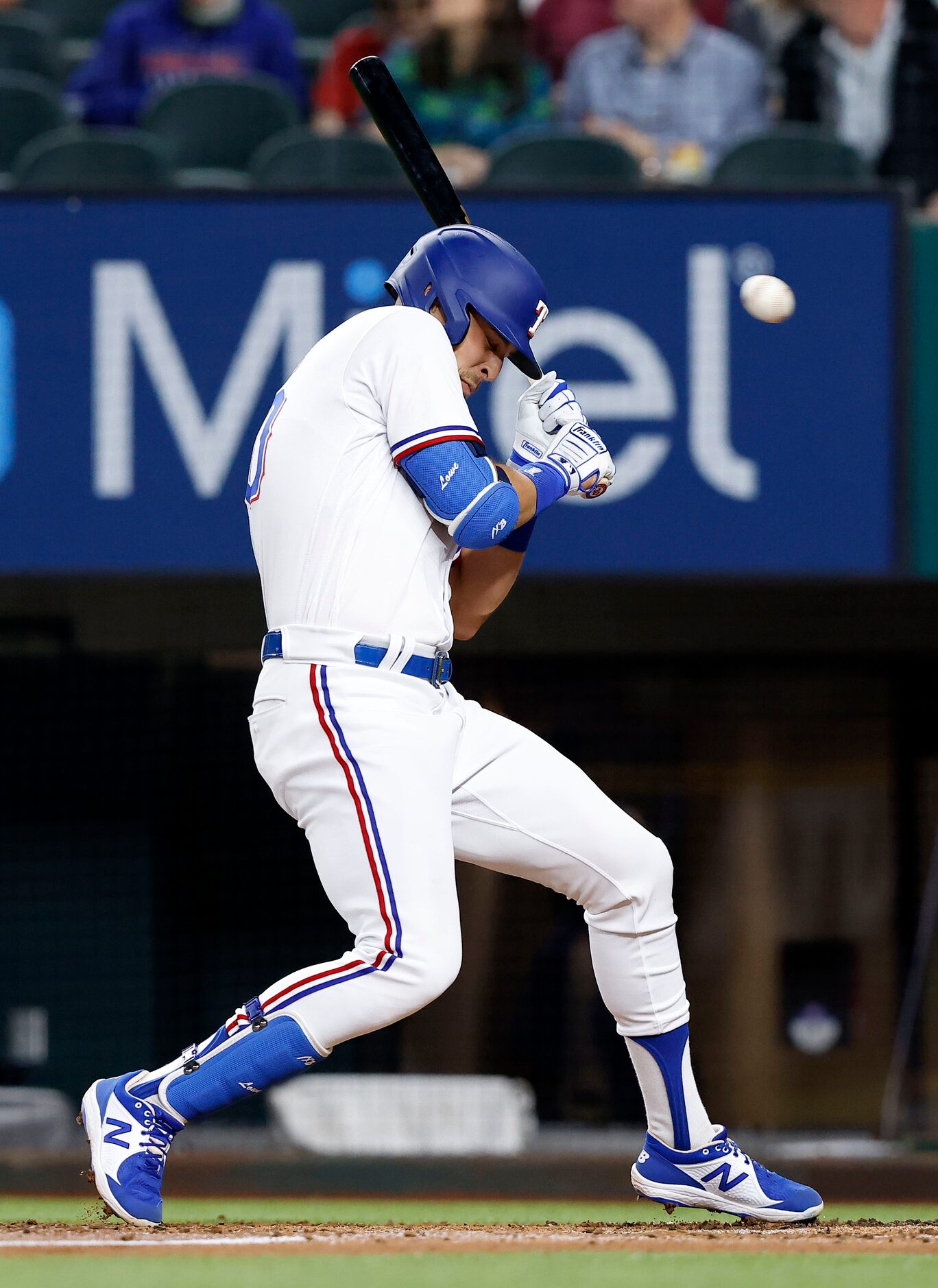 Texas Rangers first baseman Nate Lowe (30) turns away from an inside pitch from Boston Red...