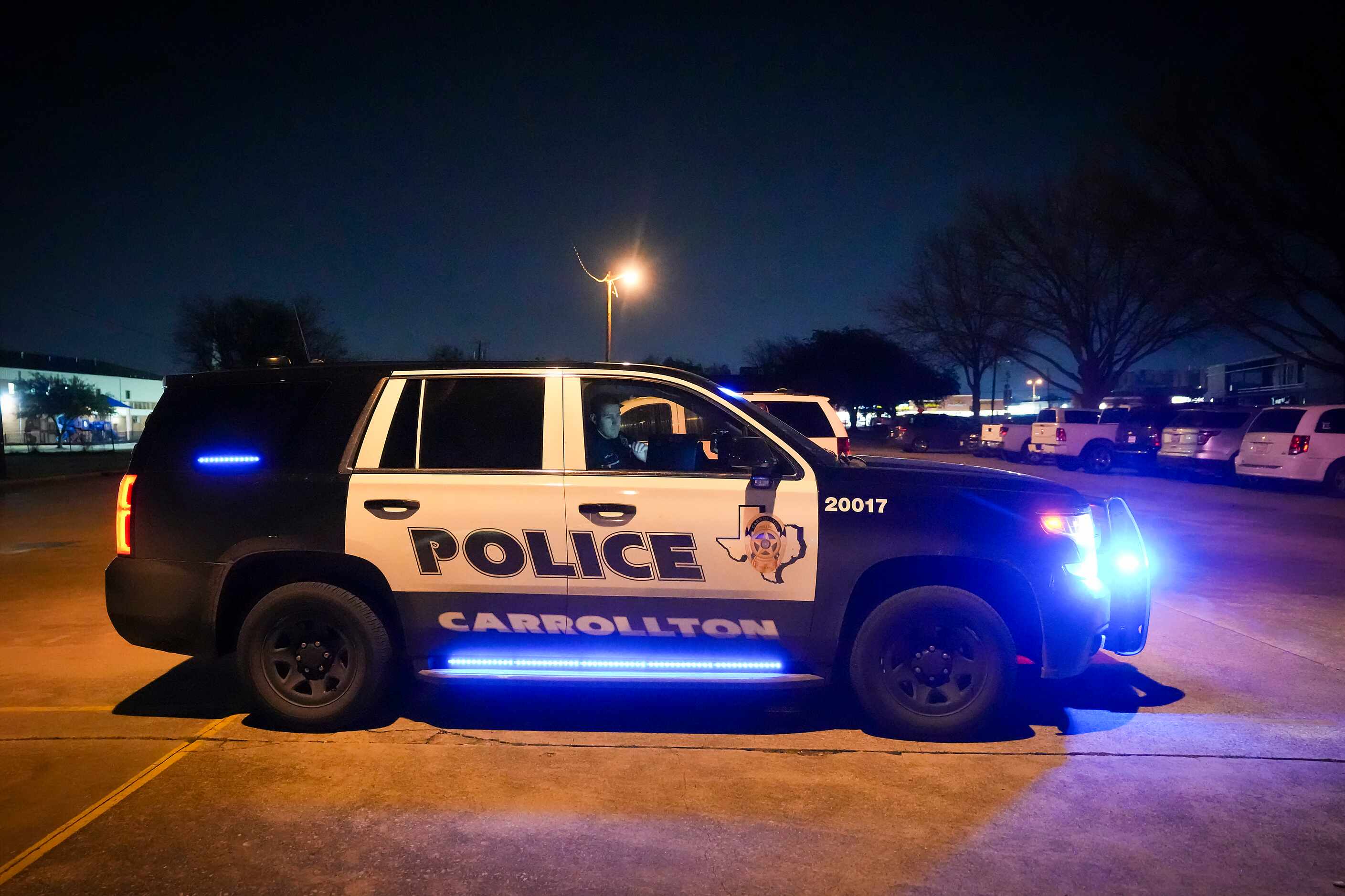 A Carrollton police officer sits outside a Student Health Advisory Council meeting on...