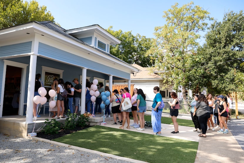 People line up to enter Blush Bookstore during the grand opening on, Saturday, Oct. 5, 2024,...