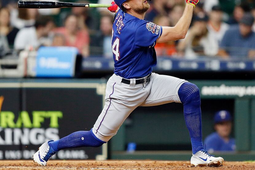 HOUSTON, TEXAS - MAY 09: Hunter Pence #24 of the Texas Rangers hits a two-run home run in...