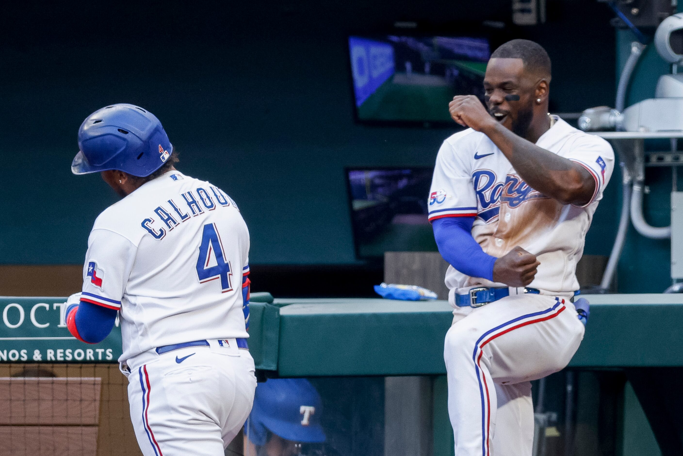 Texas Rangers left fielder Willie Calhoun (4) celebrates his game-tying home run with Texas...