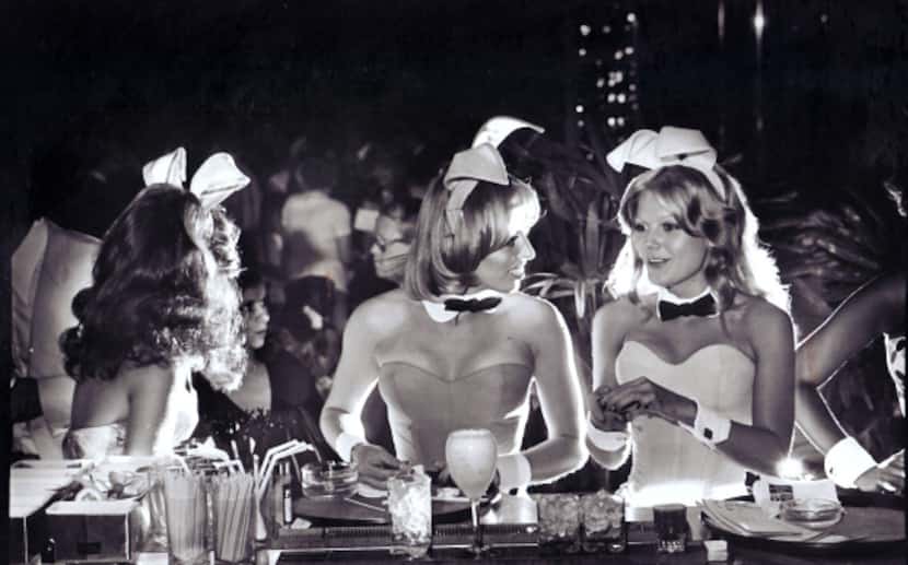 Bunnies chat at the bar of the Dallas Playboy Club, July 27, 1977.