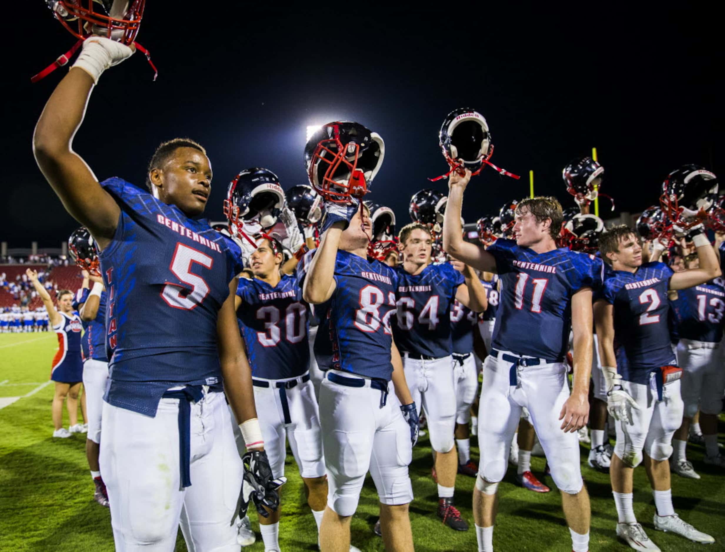 Frisco Centennial wide receiver Kenny Nelson (5) celebrates with team mates after he catches...