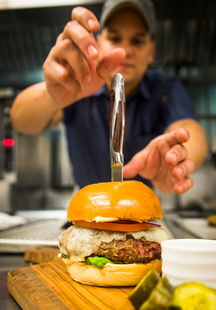 A burger might have felt informal at Cafe on the Green. At its replacement, LAW, it's a chef...