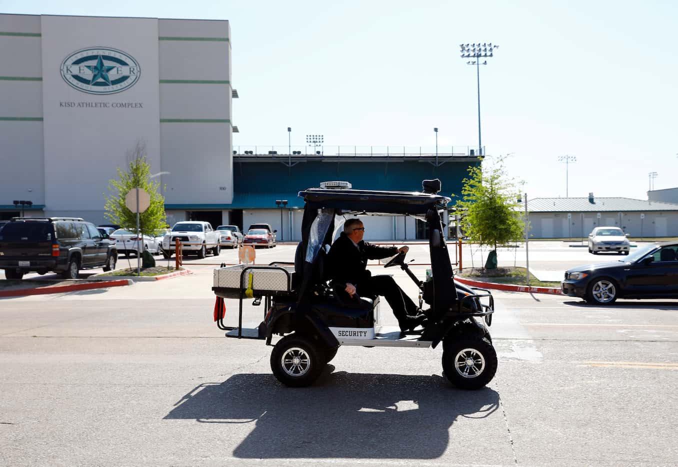 A Keller High School security patrolman passes by the Keller Athletic Complex after Keller...