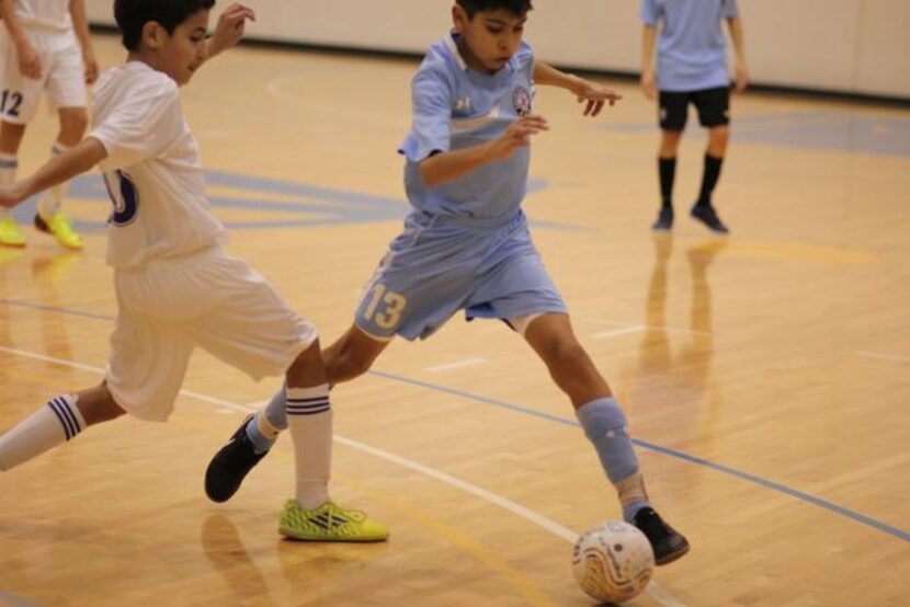 
Carlos Romero controls the ball at City Futsal in Carrollton. 
