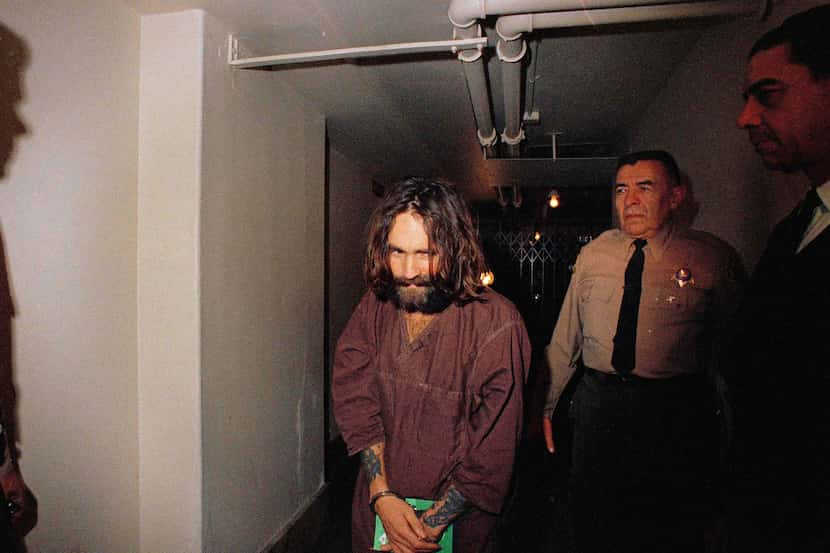 In this 1969 file photo, Charles Manson is escorted to court in Los Angeles during an...