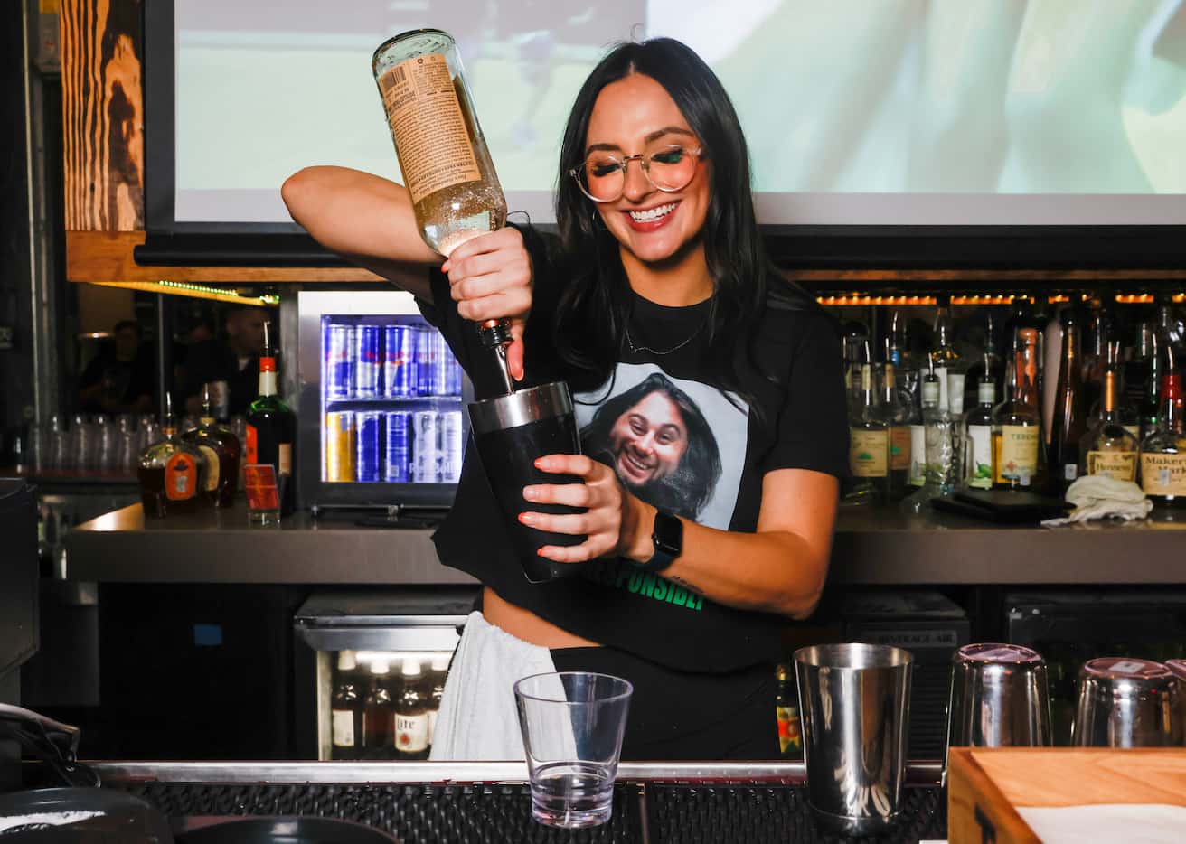 Bartender Cora Jenkins mixes a drink at Koe Wetzel's Riot Room in Fort Worth on Thursday,...