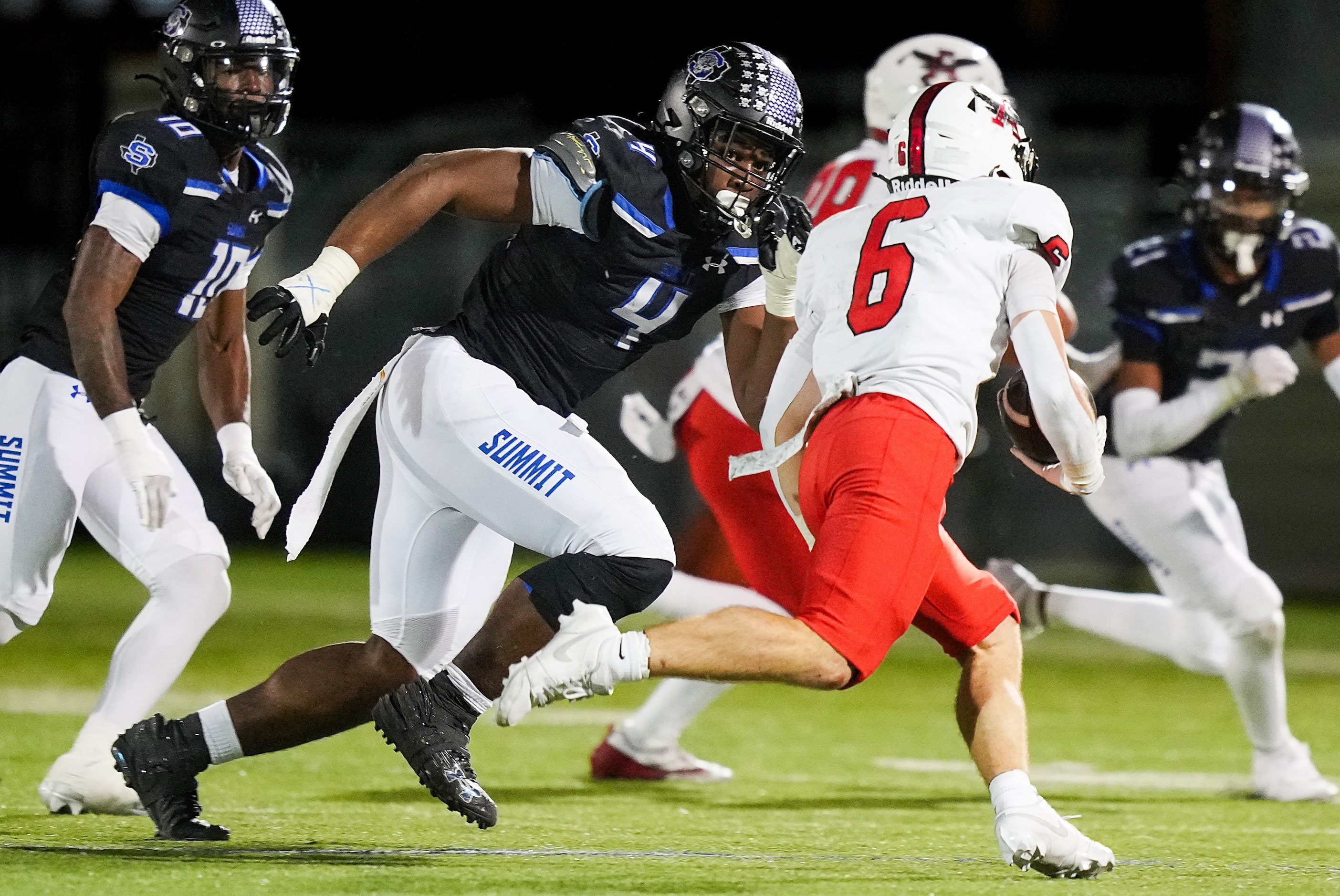 Mansfield Summit defensive lineman Travis Buhake (4) chases down Argyle running back Watson...