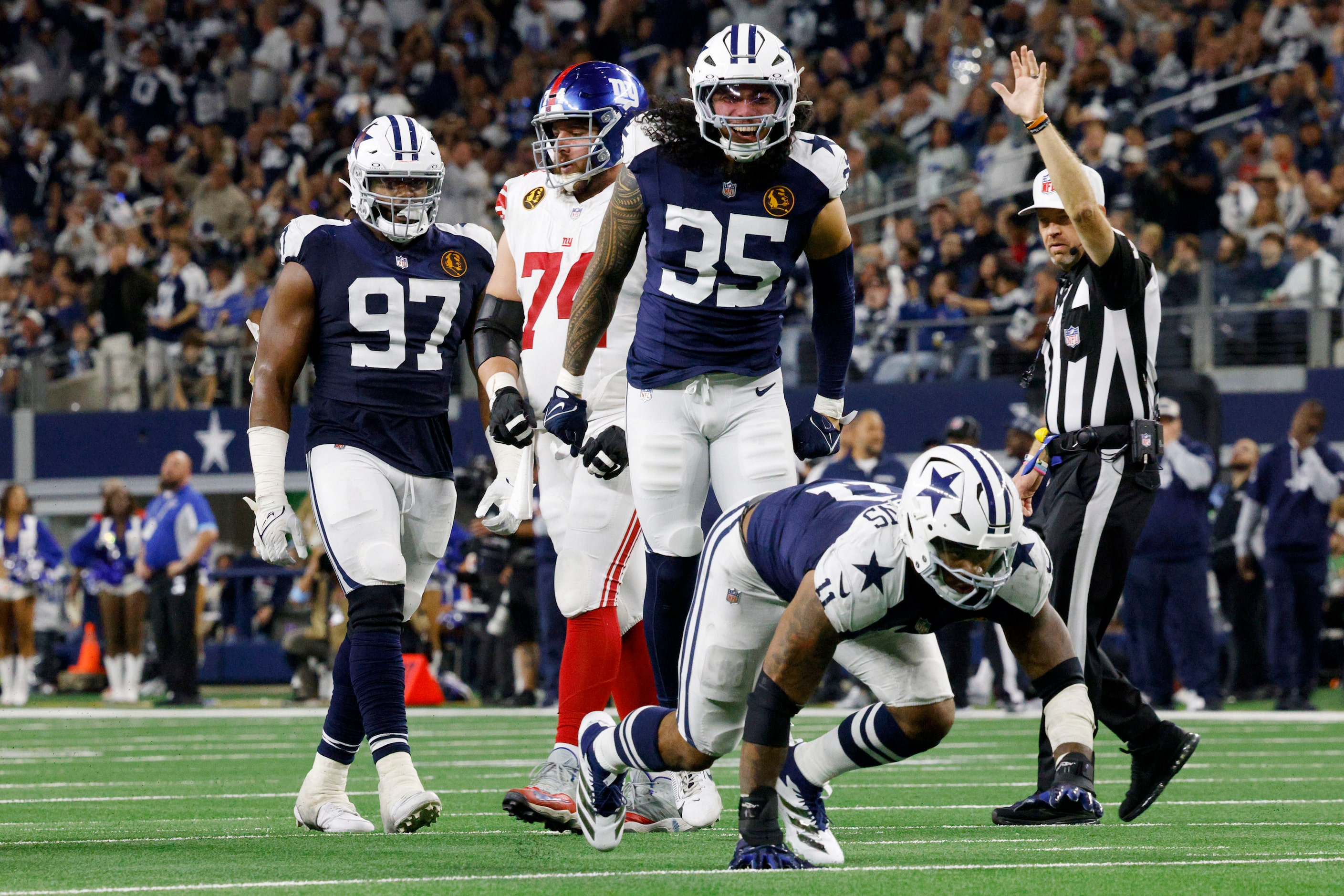 Dallas Cowboys linebacker Micah Parsons (11), bottom, and Dallas Cowboys linebacker Marist...