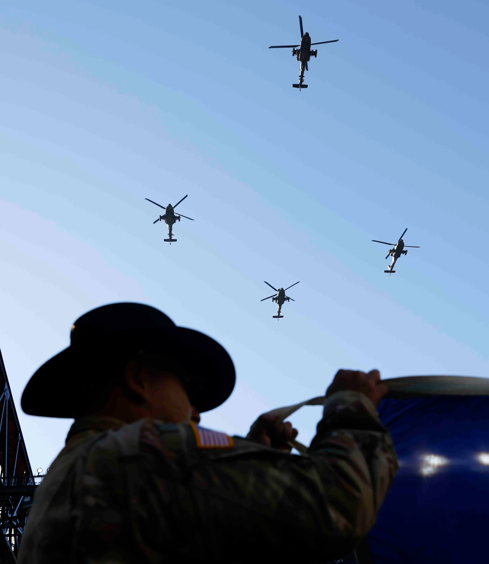 Helicopters fly above the Globe Life Field ahead of an NCAA game between Army and Air Force...