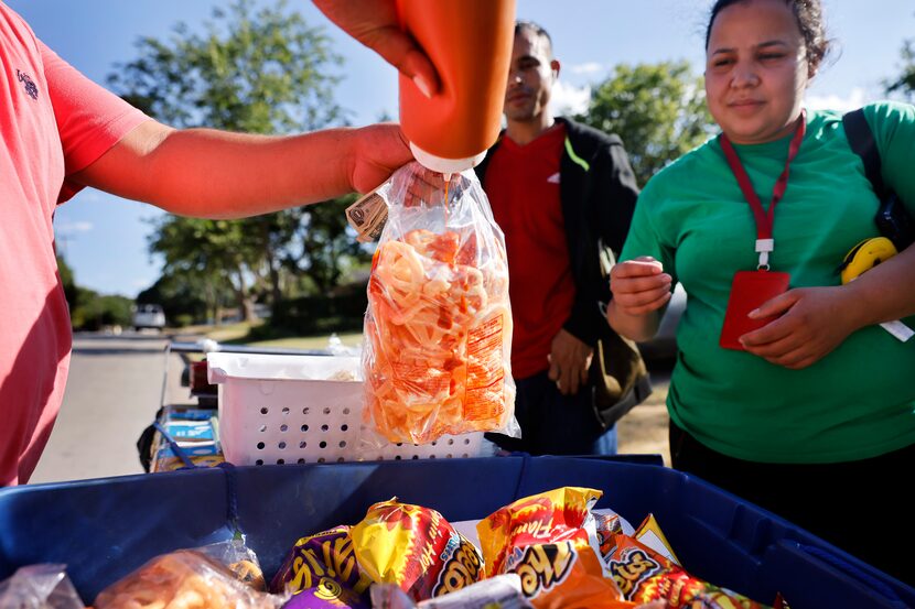 Paletero Manuel Maldonado (left), a 32 yr-old ice-cream vendor from Paleteria Delicias in...