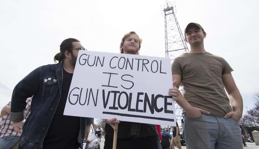 Pro-guns advocates offer their view on the guns debate during the March for Our Lives in...