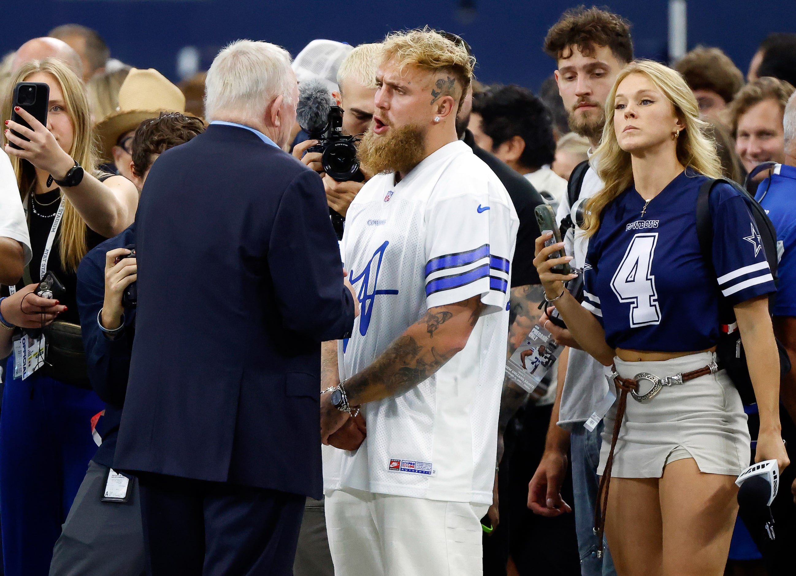 Boxer Jake Paul (right) visits with Dallas Cowboys owner Jerry Jones before the Cowboys...