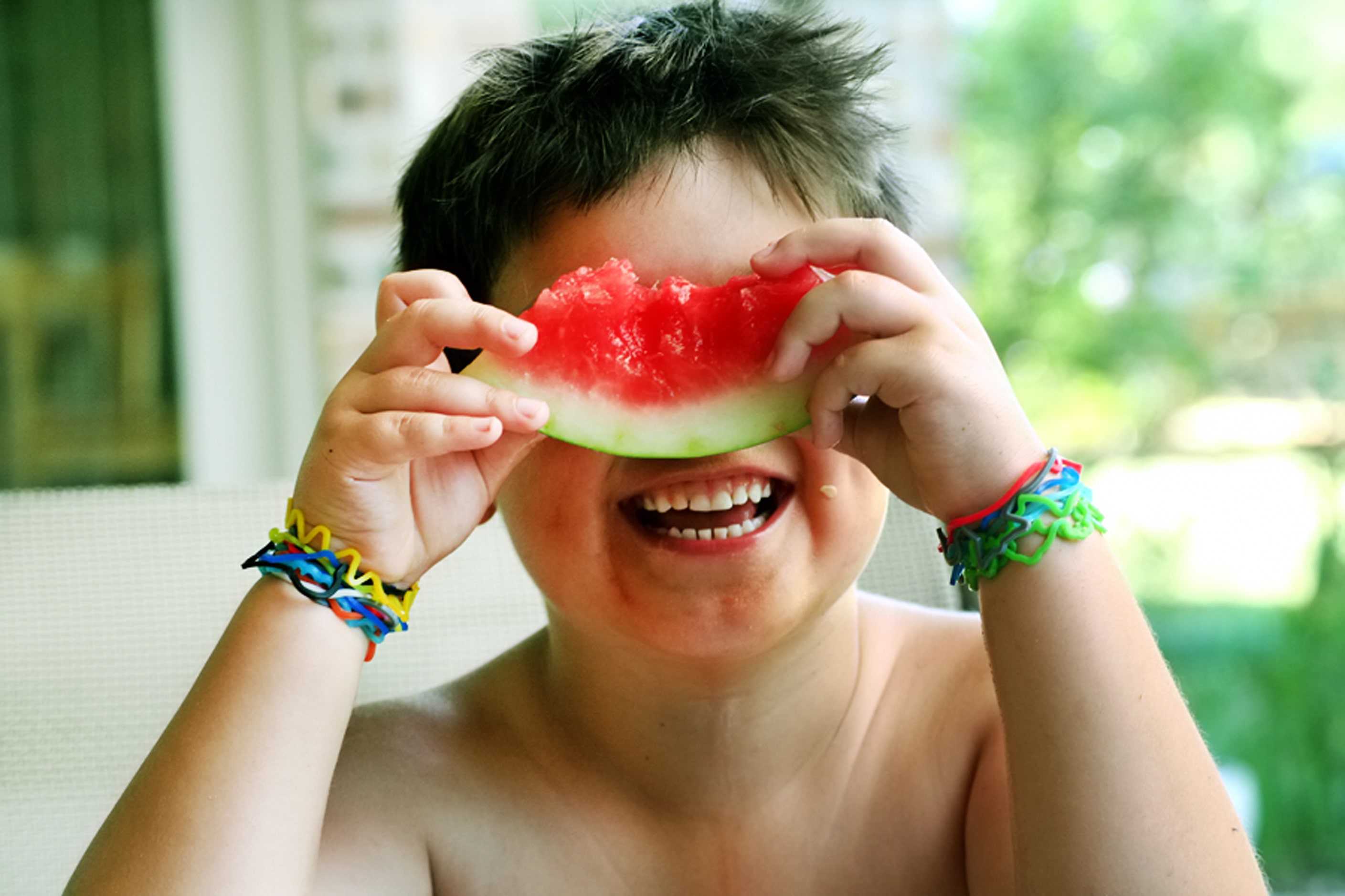 "My son enjoying watermelon in the Texas heat and wearing the infamous silly bands of his...