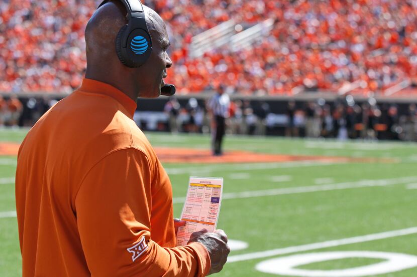 Texas head coach Charlie Strong stands on the sidelines during an NCAA college football game...
