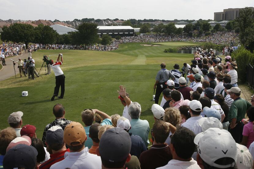 A large Sunday crowd watches as Phil Mickelson hits into the 17th green during the final...
