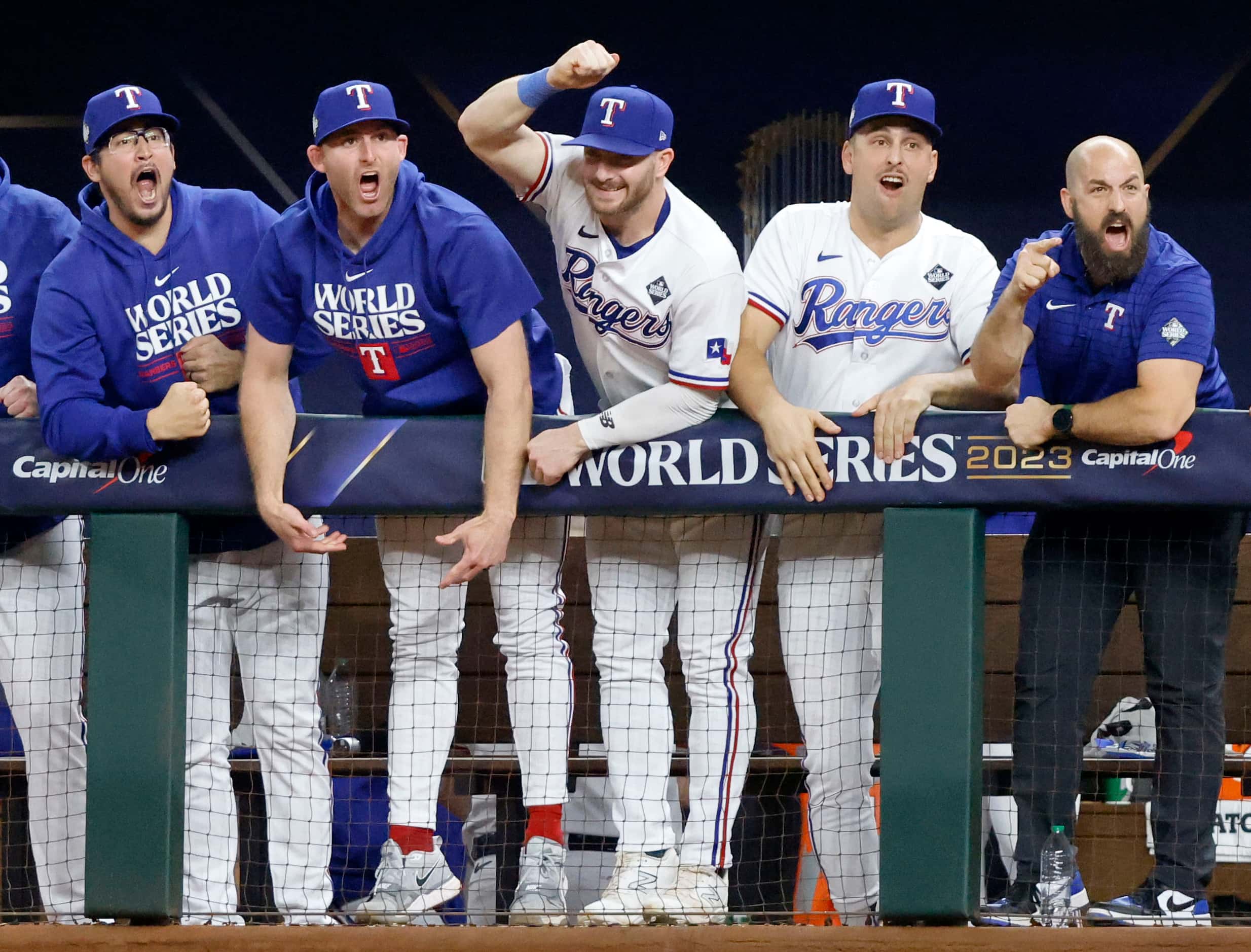 Texas Rangers players react to Corey Seager’s game-tying ninth inning homer in Game 1 of the...