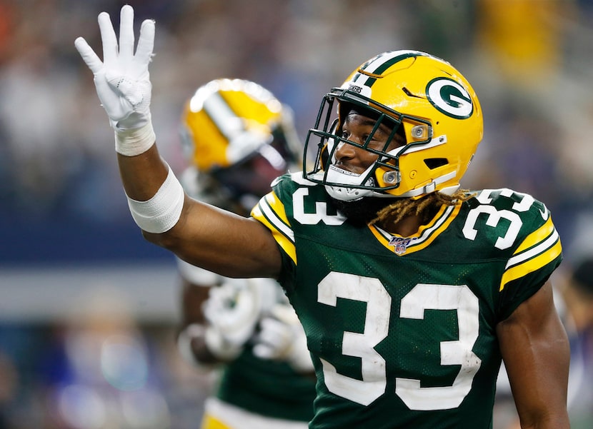 FILE - Packers running back Aaron Jones (33) celebrates his fourth touchdown against the...