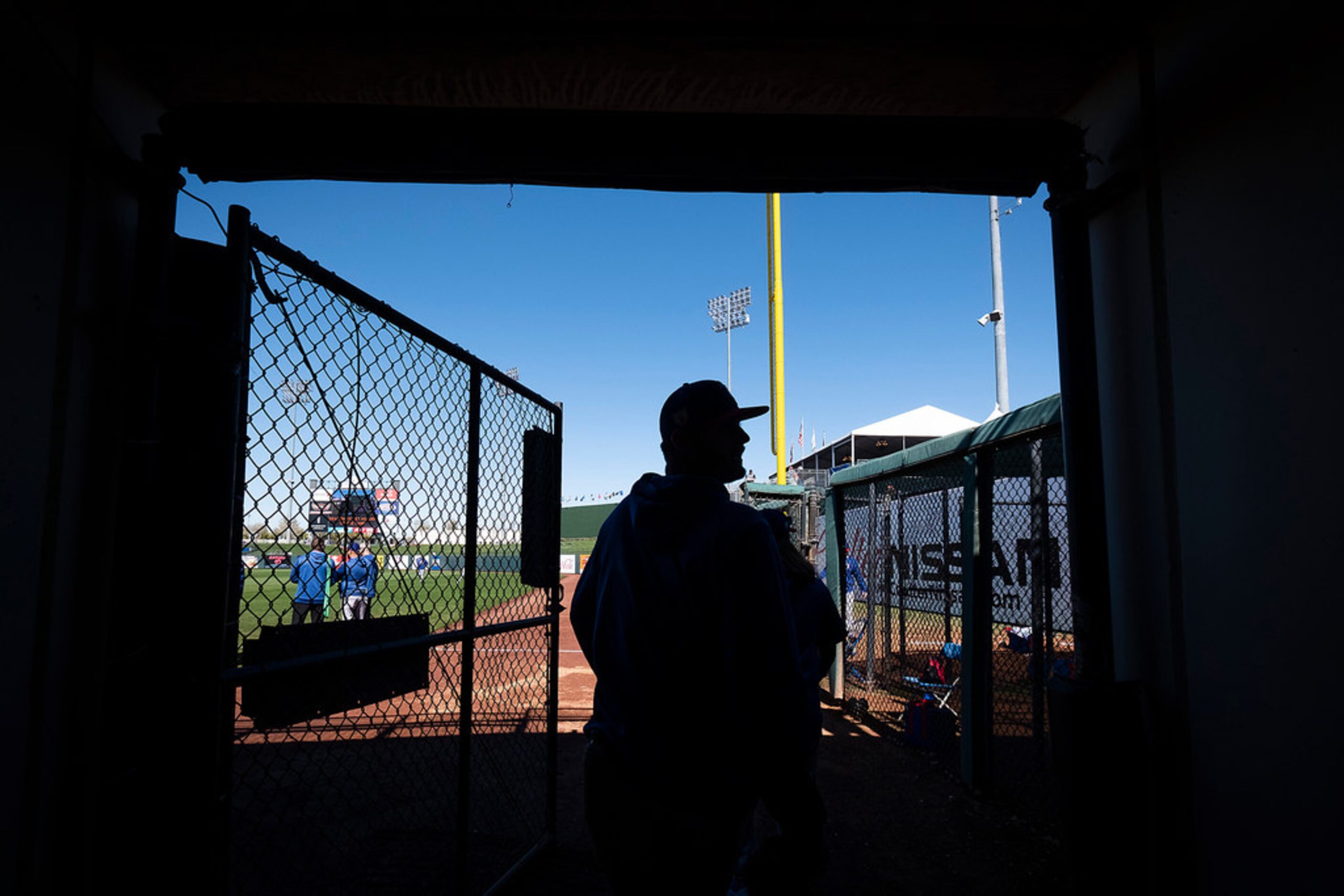 Texas Rangers pitcher Connor Sadzeck heads out the tunnel to the field for a spring training...